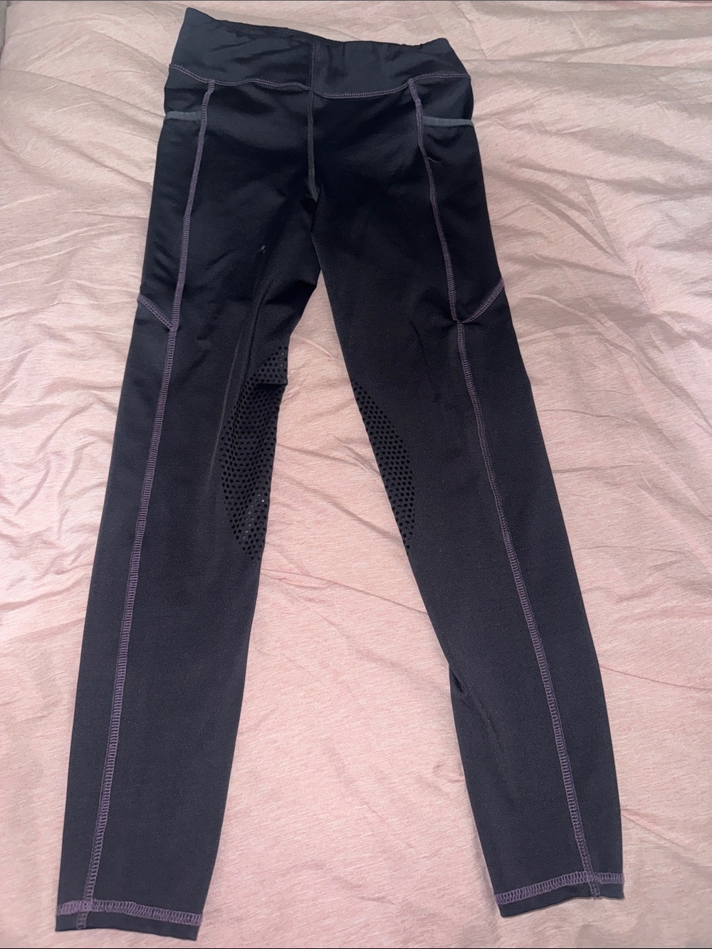 Kids(girls) dark purple riding tights with light purple stitching.